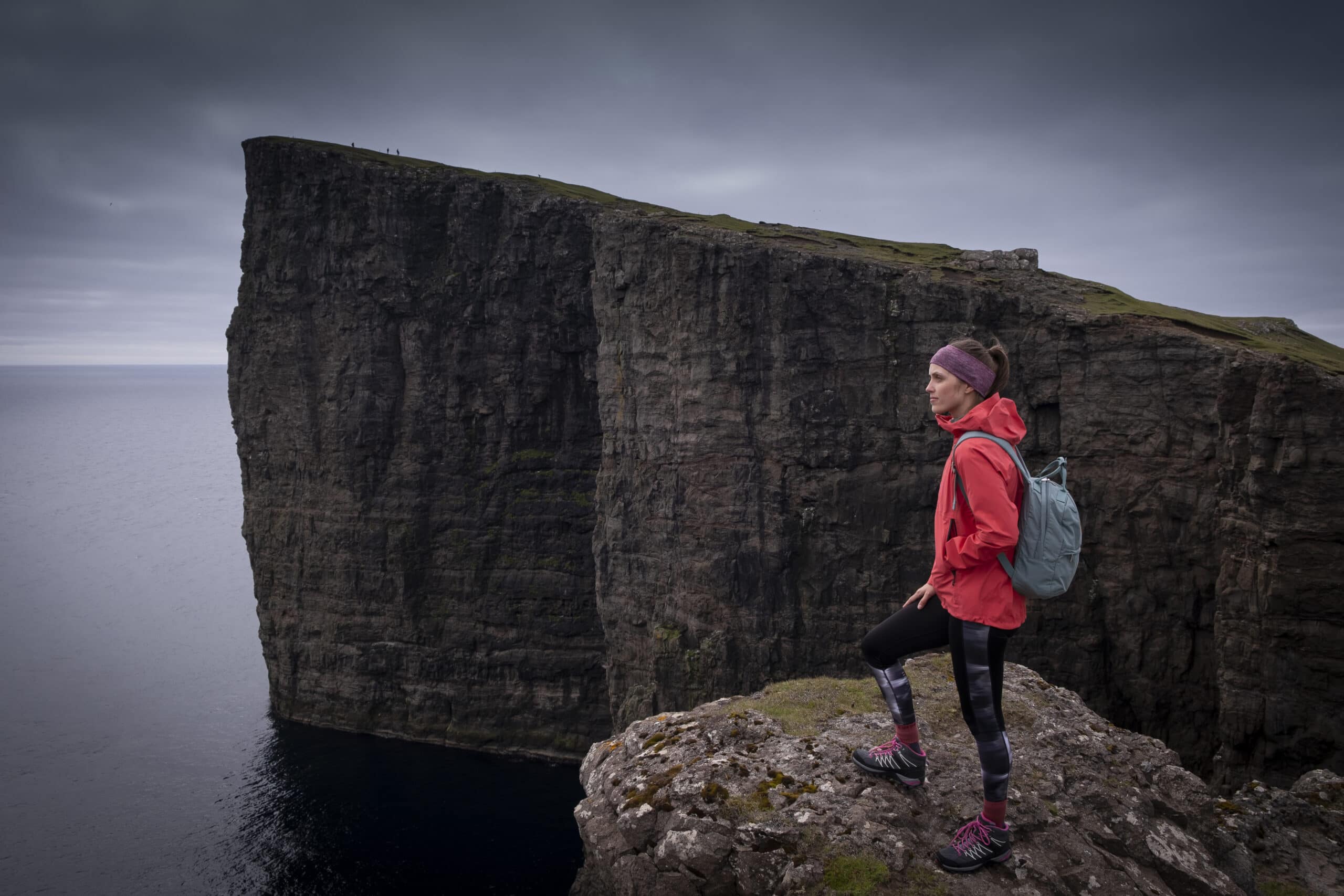 A person hiking in the Faroe Islands, enjoying the scenic views of Drangarnir